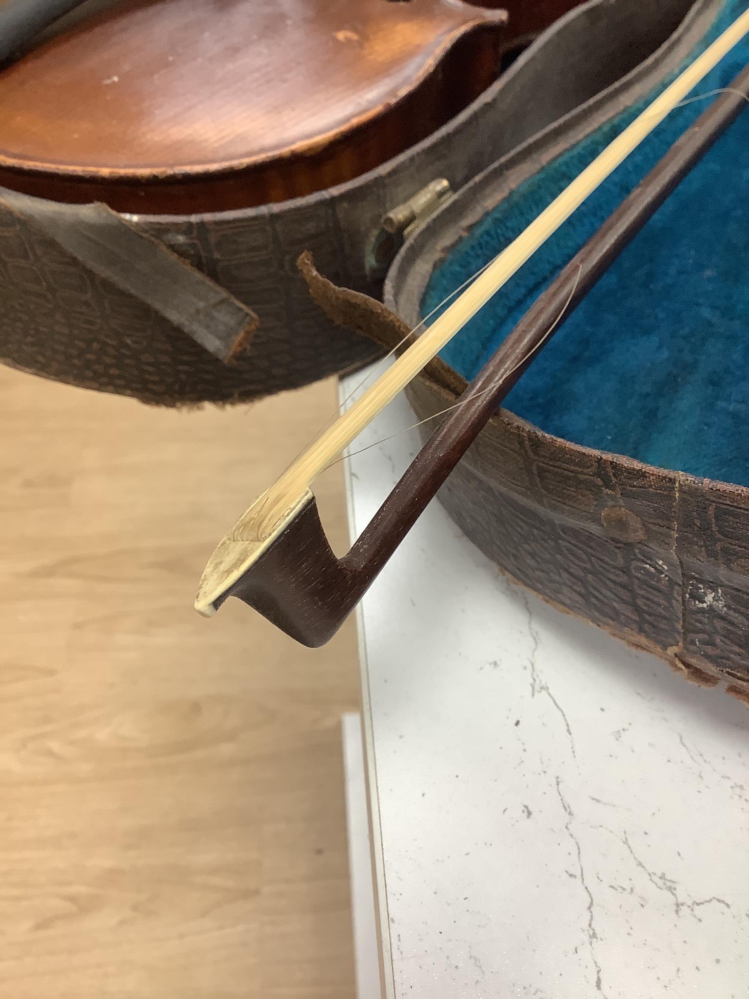 A cased violin, back 36cm, with bow